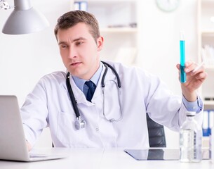 Male doctor looking at lab results in hospital