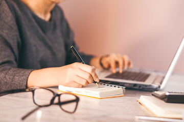 woman hand notepad and computer