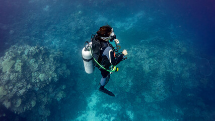 The scuba girl remains ingraved on the deep coral bottom. Munda (Solomon Islands)