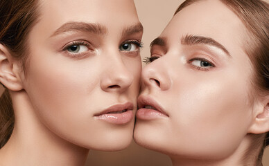 two beautiful sensual young girls with clear fresh young face skin