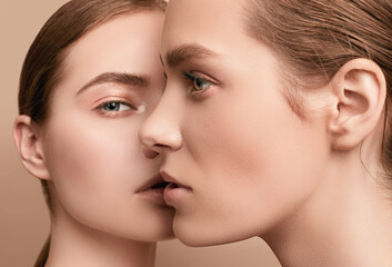 two beautiful sensual young girls with clear fresh young face skin