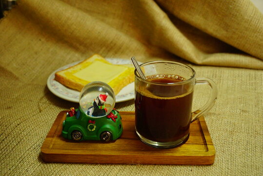 Breakfast in Christmas time : black coffee, cheese bread and santa.