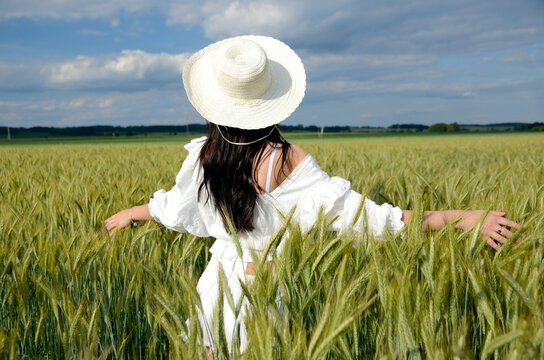 Beautiful country girl in barley field
