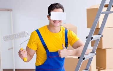 Painter contractor working with virtual reality goggles