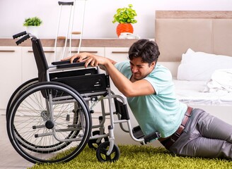 Young handsome disabled man recovering at home