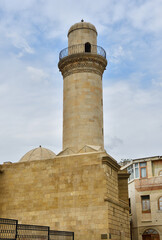 Fototapeta na wymiar Baku, Azerbaijan, Beyler (Beylyar, Beglyar) minaret of mosque of 1894-1895 years of construction, Ilyas Efendiyev street, 47