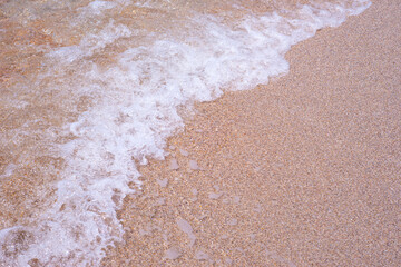  Texture of sea foam on pink sand. Backgrounds. Natural frame. Copy space for text.