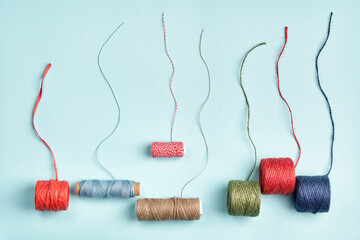 Different skeins of cords, twine, ropes for packaging and decoration