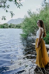 girl near lake in skirt