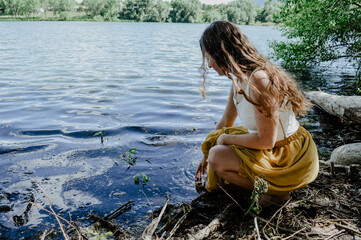 girl near lake in skirt