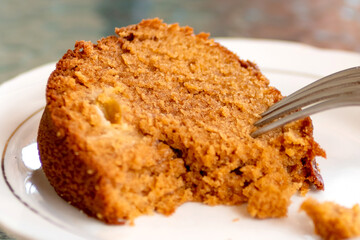 Baked pudding dessert in the plate with a fork