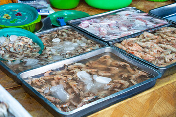 Fresh seafood on the counter at the fish market by the ocean.