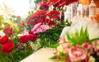 Flower shop with huge arrenge of flowers and lovely roses, floristics concept