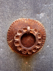 A rusty metal antique door  handle on a metal door in Mardin, Turkey. 