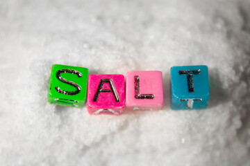 The inscription salt on sea salt background.