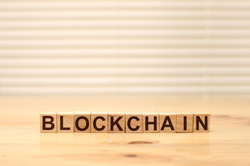 Blockchain word written on wood block. Block chain text on wooden table for your design