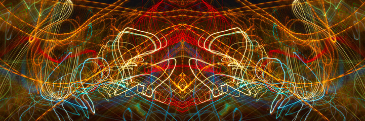 Glowing lines in black space. Movement of light on black background.