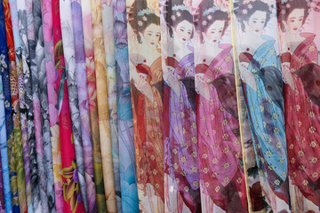 Beautiful silk scarves displayed for sale at an open-air tourist market  in Yangshuo, Fuangxi Province, China