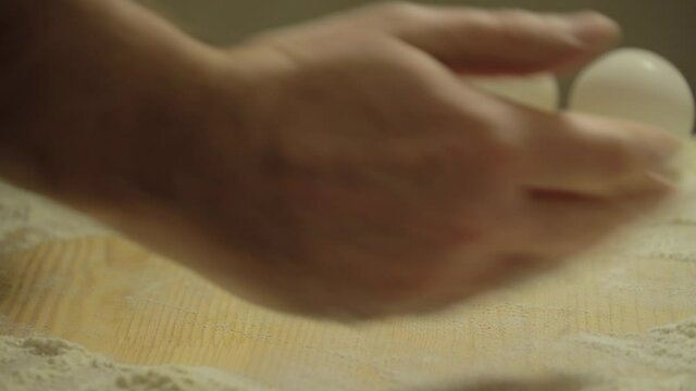 Baker Kneads Dough And Making Bread. Kneads The Dough For Pizza. Chef Prepares Dough With Flour. Hands Kneading The Dough On Table. Baker Hands Close Up. Preparing Bread. Male hands close-up.