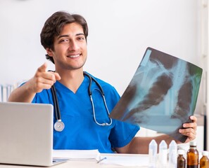 Male doctor radiologist with x-ray can image