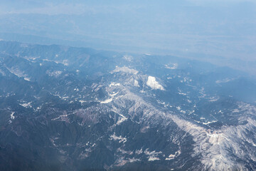 top view of high hill mountain with little foggy and a bit cover by snow