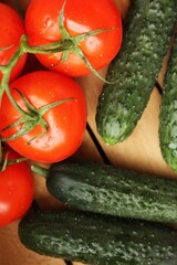 Fresh cucumbers and tomatoes on the table