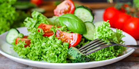 Healthy salad leaves mix vegetables (mix micro greens, juicy snack, tomato). food background copy space for text organic healthy eating keto or paleo diet
