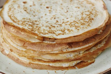 Delicious fresh crepe on the plate macro