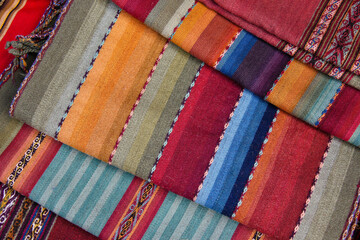 Woven textiles for sale in the market, Chinchero, Peru