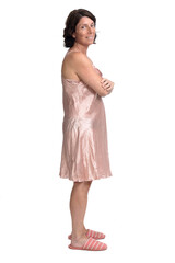 Naklejka premium side view of summer nightgown on white background, arms crossed looking at camera