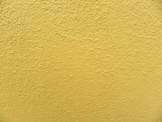 Yellow concrete wall textured background