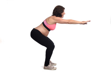 portrait of a pregnant woman exercising on white background