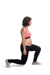 Fototapeta na wymiar portrait of a pregnant woman exercising on white background