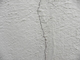 Gray cracked concrete textured background