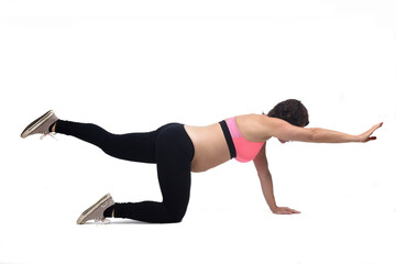 pregnant woman doing floor exercises on white background