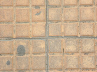 Beige color square concrete floor tiles textured background