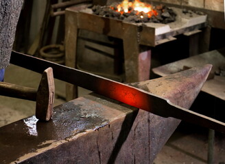 Forging hot iron
