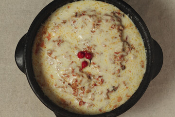 Moqueca - fish with sauce covered with cheese