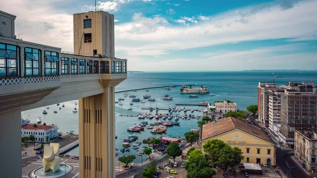 Salvador, Bahia, Brazil, zoom in timelapse view of historical landmarks Lacerda Lift and Modelo Market by day during summer.