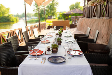 Stylish table setting in an open-air restaurant.