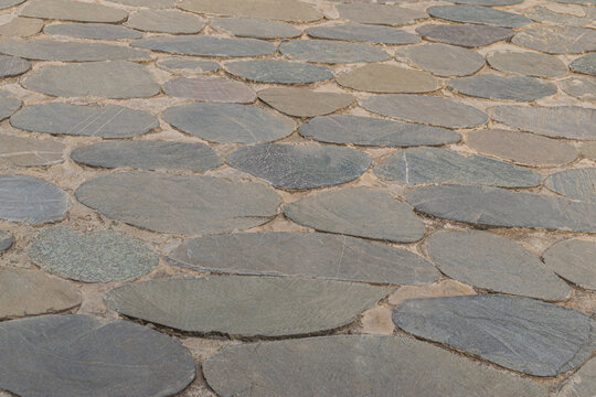 Top view of flat cobblestone pavement of the walkway. Tbilisi, Georgia 