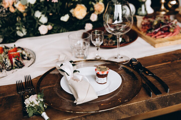 Close up of wedding details on festive wooden table