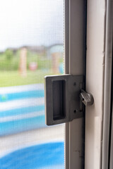 Interior sliding screen door hardware and flip latch