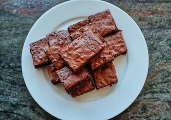 Top View Brownies served on White Plate. Homemade Gluten Free Brownie baked during Quarantine in Czech Republic.