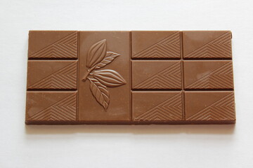 Milk chocolate isolated on white background from top view. Close up a chocolate bar isolated on white background.
