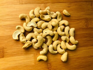 cashew nuts on wooden board
