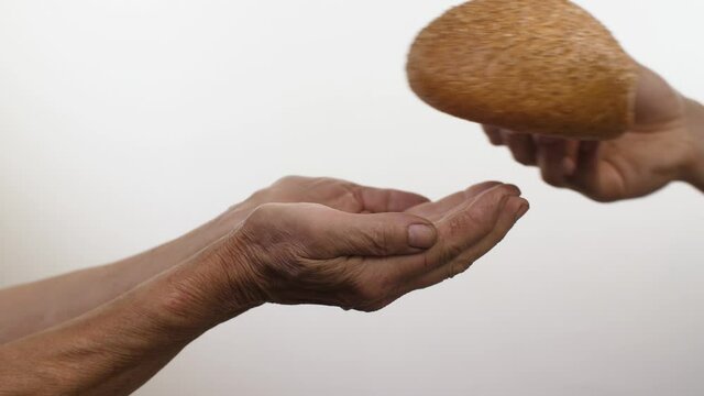 Bread in a hands of poor woman