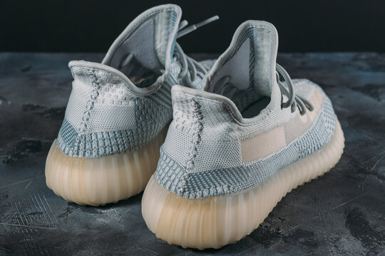 Moscow, Russia - June 2020 : Adidas Yeezy Boost 350 V2 Cloud White - Famous Limited Collection Fashion Sneakers by Kanye West and Adidas Collaboration, Trendy Sport Shoes