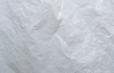 Texture of a white dense package of milky color