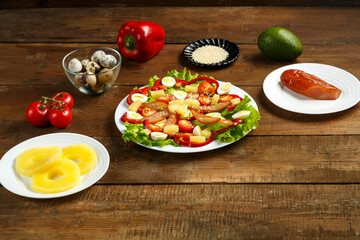 Pan-Asian salad with cherry tomatoes, smoked chicken, pineapple and sesame seeds